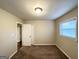 Neutral bedroom with wall-to-wall carpet, and window with blinds allowing plenty of light at 2860 Lynda Pl, Decatur, GA 30032