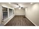 Bright living room with hardwood floors, a ceiling fan, and plenty of natural light from large windows at 2860 Lynda Pl, Decatur, GA 30032
