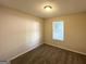 Cozy carpeted bedroom features neutral walls, a window, and ceiling fan at 614 Tramore Ct, Stockbridge, GA 30281