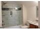 Modern bathroom featuring a tiled shower with a glass door, and granite top vanity at 141 Windward Hills, Mcdonough, GA 30253
