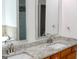 Bathroom featuring double vanity with granite countertops, offering ample space and modern elegance at 141 Windward Hills, Mcdonough, GA 30253