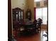 Traditional dining room boasts hardwood floors, elegant furnishings, and natural light at 141 Windward Hills, Mcdonough, GA 30253