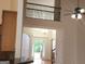 Light-filled entryway with a view of the front door, staircase, and upper-level railing at 141 Windward Hills, Mcdonough, GA 30253