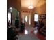 Welcoming foyer features hardwood floors, high ceilings, and front door with sidelights at 141 Windward Hills, Mcdonough, GA 30253