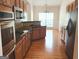 Spacious kitchen with stainless steel appliances, dark countertops, and hardwood flooring at 141 Windward Hills, Mcdonough, GA 30253