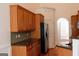 Well-equipped kitchen with stainless steel appliances, ample cabinet space, and dark countertops, perfect for cooking at 141 Windward Hills, Mcdonough, GA 30253