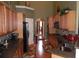 Kitchen with stainless appliances, granite counters, and natural wood cabinets at 141 Windward Hills, Mcdonough, GA 30253