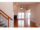 Bright living room featuring a fireplace, vaulted ceiling, hardwood floors, and neutral paint at 141 Windward Hills, Mcdonough, GA 30253