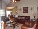 Spacious living room with high ceilings, comfortable leather furniture, and stylish decor at 141 Windward Hills, Mcdonough, GA 30253