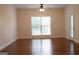 Bright living room with hardwood floors, large window, and access to the outdoors at 141 Windward Hills, Mcdonough, GA 30253