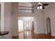 Spacious living area with high ceilings, hardwood floors, and a second-story overlook, perfect for relaxation at 141 Windward Hills, Mcdonough, GA 30253