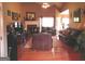Spacious living room features hardwood floors, a fireplace, and ample natural light at 141 Windward Hills, Mcdonough, GA 30253