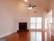 Spacious living room with a fireplace and high ceilings, offering ample natural light and an open layout at 141 Windward Hills, Mcdonough, GA 30253