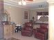 Main bedroom with an ornate bed, decorative mirror, and seating area at 141 Windward Hills, Mcdonough, GA 30253