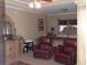 Serene main bedroom with a canopy bed, a sitting area, and an ornate dresser at 141 Windward Hills, Mcdonough, GA 30253