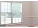 Bright window with white trim and blinds, offering natural light and privacy in this room at 141 Windward Hills, Mcdonough, GA 30253