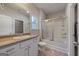 Well-lit bathroom with a shower-tub combo and vanity storage, offering functionality at 385 Orchard Land, Covington, GA 30014