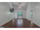 Spacious bedroom with vaulted ceiling, large window, and hardwood flooring at 385 Orchard Land, Covington, GA 30014