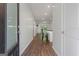 Inviting foyer with hardwood floors leading into an open-concept living area with a modern kitchen and natural light at 385 Orchard Land, Covington, GA 30014