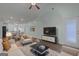 Open-concept living room with hardwood floors, ceiling fan, and lots of natural light at 385 Orchard Land, Covington, GA 30014