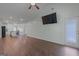 Open-concept living room with hardwood floors and access to the kitchen and entry at 385 Orchard Land, Covington, GA 30014