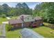 Aerial view of home featuring a large backyard, storage building and driveway at 6023 Highway 20 S, Covington, GA 30016