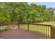 This back deck overlooks the spacious yard and lush landscaping at 6023 Highway 20 S, Covington, GA 30016