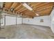 Unfinished basement with exposed ceiling and concrete floors at 6023 Highway 20 S, Covington, GA 30016