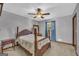 Bedroom featuring a ceiling fan, and a decorative four poster bed frame at 6023 Highway 20 S, Covington, GA 30016
