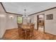Charming dining room with hardwood floors, classic furniture, and natural light, ideal for Gathering meals at 6023 Highway 20 S, Covington, GA 30016