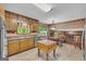 Spacious kitchen with wood cabinets and views of backyard at 6023 Highway 20 S, Covington, GA 30016