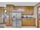 Kitchen with stainless steel refrigerator and dark countertops at 6023 Highway 20 S, Covington, GA 30016