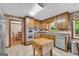Kitchen with stainless steel appliances and wood cabinets at 6023 Highway 20 S, Covington, GA 30016