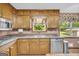 Bright kitchen with stainless steel dishwasher and faucet fixtures at 6023 Highway 20 S, Covington, GA 30016