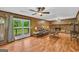 Spacious living room featuring a brick fireplace and access to an outdoor deck at 6023 Highway 20 S, Covington, GA 30016
