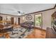 Bright living room with hardwood floors, large windows, and comfortable seating, creating a welcoming atmosphere at 6023 Highway 20 S, Covington, GA 30016
