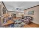 Spacious living room with hardwood floors, ample seating, and a ceiling fan, great for Gathering gatherings at 6023 Highway 20 S, Covington, GA 30016