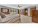 This main bedroom boasts carpet flooring, ensuite bath and ample space for dressers at 6023 Highway 20 S, Covington, GA 30016