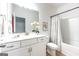 Clean bathroom with marble countertop, white cabinets, and shower/tub combo at 5350 Woodline View Cir, Hoschton, GA 30548