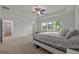 Spacious bedroom features tray ceilings and large windows for lots of natural light at 5350 Woodline View Cir, Hoschton, GA 30548
