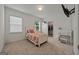 Cozy bedroom featuring a walk-in closet, study desk and plush carpet at 5350 Woodline View Cir, Hoschton, GA 30548