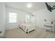 Lovely bedroom featuring a comfortable bed, bright natural light, and charming decor at 5350 Woodline View Cir, Hoschton, GA 30548
