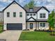 Charming two-story home featuring a mix of brick and siding, complemented by a well-manicured lawn at 5350 Woodline View Cir, Hoschton, GA 30548