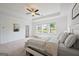 Serene main bedroom with natural light and a comfortable queen-size bed at 5350 Woodline View Cir, Hoschton, GA 30548
