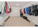 Large walk-in closet with ample shelving, storage and carpeted floor at 5350 Woodline View Cir, Hoschton, GA 30548
