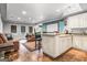 Finished basement with wet bar, movie screen, living space, and a large window for natural light at 719 Bethpage Dr, Mcdonough, GA 30253