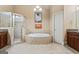 Bathroom featuring a shower, a bathtub, dual vanity sinks, and tiled flooring at 719 Bethpage Dr, Mcdonough, GA 30253