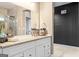 Bathroom with a granite countertop vanity, and a large mirror offering an open view to the shower at 719 Bethpage Dr, Mcdonough, GA 30253