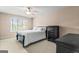 Comfortable bedroom with a ceiling fan and a large window at 719 Bethpage Dr, Mcdonough, GA 30253