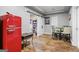 Basement dining area showcasing a retro-style refrigerator, a library, and an adjacent dining table at 719 Bethpage Dr, Mcdonough, GA 30253